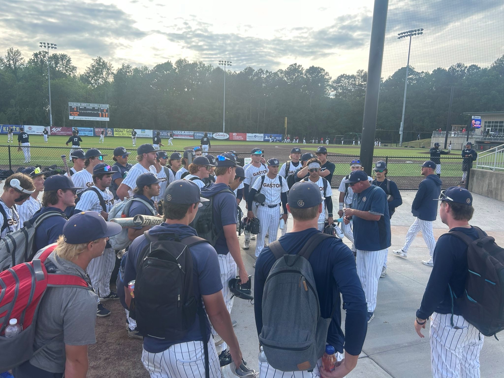 Gaston College coach Shohn Doty addresses his team after Friday's Region 10 tournament victory in Lexington, S.C.