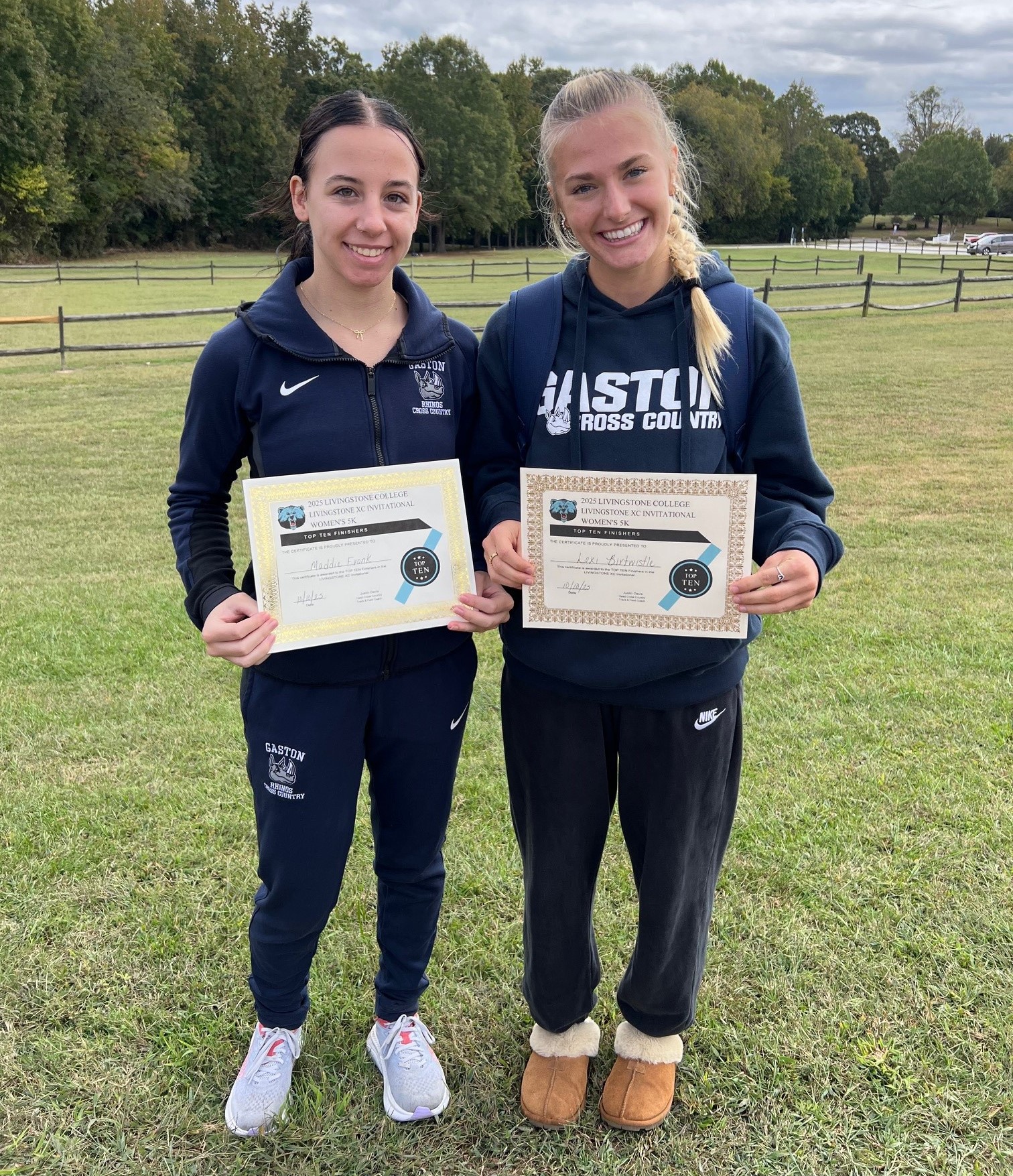 Gaston College's Maddie Frank (left) and Lexi Birtwistle show off their top finisher certificates from Friday's Livingstone Cross Country Invitational in Salisbury.